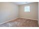 Bright bedroom with neutral walls and carpet flooring at 1507 Hillside Se Dr, Conyers, GA 30094