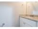Small bathroom with granite countertop, white vanity, and updated fixtures at 1507 Hillside Se Dr, Conyers, GA 30094