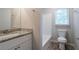 Clean bathroom with granite countertop and bathtub at 1507 Hillside Se Dr, Conyers, GA 30094