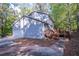 Home's side view, showing garage and deck at 1507 Hillside Se Dr, Conyers, GA 30094