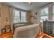 Main bedroom with hardwood floors, a dresser, and large windows at 733 Frederica Ne St # 2, Atlanta, GA 30306