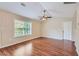 Bright living room with hardwood floors and large window at 9170 Jefferson Sw Ave, Covington, GA 30014