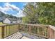Wooden deck overlooks backyard with green space and trees at 9170 Jefferson Sw Ave, Covington, GA 30014