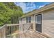 Deck view of home's exterior and wooded area at 9170 Jefferson Sw Ave, Covington, GA 30014