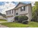 Tan house with white garage door and white stairs at 9170 Jefferson Sw Ave, Covington, GA 30014