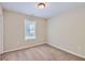 Bright bedroom with neutral walls and carpeted floor at 9170 Jefferson Sw Ave, Covington, GA 30014