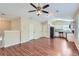 Open floor plan with kitchen featuring stainless steel appliances and a living area with hardwood floors at 9170 Jefferson Sw Ave, Covington, GA 30014