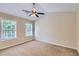Spacious bedroom with neutral walls, ceiling fan, and carpet at 9170 Jefferson Sw Ave, Covington, GA 30014