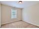 Bright bedroom with neutral walls and carpeted floor at 9170 Jefferson Sw Ave, Covington, GA 30014