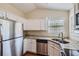 Modern kitchen with granite countertops and stainless steel appliances at 9170 Jefferson Sw Ave, Covington, GA 30014