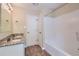 Bathroom with tub shower combo and granite vanity at 9170 Jefferson Sw Ave, Covington, GA 30014