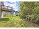 View of backyard from deck, showing green space and trees at 9170 Jefferson Sw Ave, Covington, GA 30014