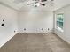 Spacious bedroom with ceiling fan and window at 4060 Willowmere Pointe Nw, Kennesaw, GA 30144