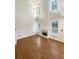 Bright living room featuring hardwood floors and a fireplace at 4060 Willowmere Pointe Nw, Kennesaw, GA 30144