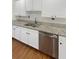 White shaker cabinets, granite counters, and stainless steel dishwasher at 4060 Willowmere Pointe Nw, Kennesaw, GA 30144