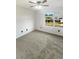 Spacious bedroom with large window and ceiling fan at 4060 Willowmere Pointe Nw, Kennesaw, GA 30144