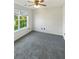 Bright bedroom with ceiling fan and window at 4060 Willowmere Pointe Nw, Kennesaw, GA 30144
