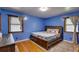 Bedroom with a wooden bed frame and hardwood floors at 903 Bingham Ln, Stone Mountain, GA 30083