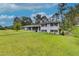 Ranch house with white brick exterior and landscaping at 903 Bingham Ln, Stone Mountain, GA 30083