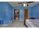 Bright bedroom with tiled floors and a ceiling fan at 903 Bingham Ln, Stone Mountain, GA 30083