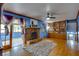 Living room with fireplace, hardwood floors, and access to sunroom at 903 Bingham Ln, Stone Mountain, GA 30083