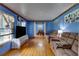 View of living room and dining room with hardwood floors at 903 Bingham Ln, Stone Mountain, GA 30083