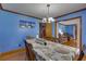 Bright dining room with hardwood floors and views into living room at 903 Bingham Ln, Stone Mountain, GA 30083