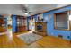 Living room with hardwood floors, fireplace, and built-in hutch at 903 Bingham Ln, Stone Mountain, GA 30083