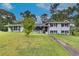 Ranch house with white brick exterior and landscaping at 903 Bingham Ln, Stone Mountain, GA 30083