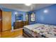 Bedroom with dresser, large bed, and hardwood floors at 903 Bingham Ln, Stone Mountain, GA 30083