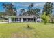 Ranch house with white brick exterior and landscaping at 903 Bingham Ln, Stone Mountain, GA 30083