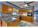 Kitchen with granite countertops, wood cabinets, and island at 903 Bingham Ln, Stone Mountain, GA 30083