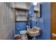 Small bathroom with shower, toilet and a pedestal sink at 903 Bingham Ln, Stone Mountain, GA 30083