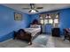 Spacious bedroom with a large bed and a ceiling fan at 903 Bingham Ln, Stone Mountain, GA 30083