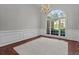 Bright dining room with hardwood floors, arched window and chandelier at 3680 Windlake Dr, Snellville, GA 30039