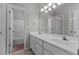 Bathroom with double vanity and tub/shower combo at 3680 Windlake Dr, Snellville, GA 30039