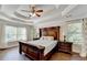 Spacious bedroom with ceiling fan and large bed at 1984 Buford Dam Rd, Buford, GA 30518