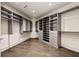 Spacious walk-in closet with ample shelving and hanging space at 3107 Peachtree Road Ne Unit #1803, Atlanta, GA 30305