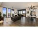 Open concept living and dining area with hardwood floors, floor-to-ceiling windows, and modern furniture at 3107 Peachtree Road Ne Unit #1803, Atlanta, GA 30305