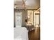 Bright bedroom with hardwood floors, ensuite bathroom access, and city views at 3107 Peachtree Road Ne Unit #1803, Atlanta, GA 30305