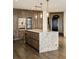 Large kitchen island with stunning granite countertop and wooden cabinetry at 3107 Peachtree Road Ne Unit #1803, Atlanta, GA 30305