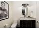 Stylish bathroom with a modern vanity and an Elvis Presley print at 3107 Peachtree Road Ne Unit #1803, Atlanta, GA 30305
