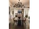 Elegant dining room features a statement chandelier and a large dining table at 3107 Peachtree Road Ne Unit #1803, Atlanta, GA 30305