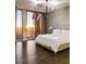 Bright bedroom with stunning city views and hardwood floors at 3107 Peachtree Road Ne Unit #1803, Atlanta, GA 30305