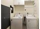 Bright laundry room with washer and dryer, and extra storage at 3107 Peachtree Road Ne Unit #1803, Atlanta, GA 30305