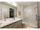 Clean bathroom with a walk-in shower and modern vanity at 3107 Peachtree Road Ne Unit #1803, Atlanta, GA 30305