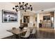 Open concept dining room with hardwood floors and modern chandelier at 3107 Peachtree Road Ne Unit #1803, Atlanta, GA 30305