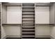 Well-organized closet with shelves and hanging rods at 3107 Peachtree Road Ne Unit #1803, Atlanta, GA 30305