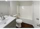 Clean bathroom with a single vanity, toilet and tub at 340 Lakeview Trl, Covington, GA 30016