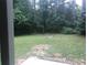Wooded backyard with firepit at 5364 Cedar Rock Dr, Stonecrest, GA 30038